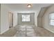 Large bonus room with neutral carpet, lots of natural light, and white trim at 1112 Birch Sw St, Atlanta, GA 30310