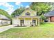 Charming yellow two-story home with a well-manicured lawn and inviting front porch at 1112 Birch Sw St, Atlanta, GA 30310