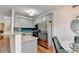 Modern kitchen with granite countertops, stainless steel appliances, and blue tile backsplash at 1112 Birch Sw St, Atlanta, GA 30310