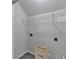 Laundry room features a white storage shelf, hookups, and a 'Laundry' bin at 1112 Birch Sw St, Atlanta, GA 30310