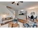 Open-concept living and dining area with hardwood floors and a modern chandelier at 1112 Birch Sw St, Atlanta, GA 30310