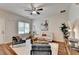 Stylish living room with modern furniture, a ceiling fan, and hardwood floors at 1112 Birch Sw St, Atlanta, GA 30310