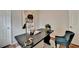 This office features neutral walls, a black table, and modern decor at 1112 Birch Sw St, Atlanta, GA 30310