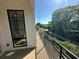 Balcony with black metal railing overlooking green trees and pathway at 127 Stein Steel Street # 112, Atlanta, GA 30316