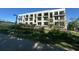 Modern three-story apartment building featuring balconies and lots of natural light in a landscaped setting at 127 Stein Steel Street # 112, Atlanta, GA 30316