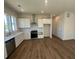 Open kitchen with stainless steel appliances, light countertops, and hardwood flooring at 127 Stein Steel Street # 112, Atlanta, GA 30316