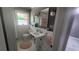 Bright bathroom featuring a pedestal sink, stylish fixtures, and modern décor for a clean and functional space at 2132 Clairmont Rd, Brookhaven, GA 30033