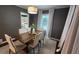 An inviting dining room featuring a modern light fixture, sleek table and chairs, and stylish décor at 2132 Clairmont Rd, Brookhaven, GA 30033