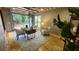 Stylish home office with hardwood floors, modern furniture, and abundant natural light at 2132 Clairmont Rd, Brookhaven, GA 30033