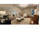 Open living room with hardwood floors, neutral decor, modern lighting, and bright natural light at 2132 Clairmont Rd, Brookhaven, GA 30033