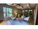 Bright home office featuring a unique glass ceiling, large windows, hardwood floors, and stylish modern decor at 2132 Clairmont Rd, Brookhaven, GA 30033