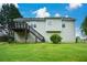 Large backyard with a lush lawn and a deck, creating an ideal setting for relaxation and outdoor enjoyment at 30 W Fork Way, Temple, GA 30179