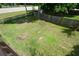 Overhead shot of backyard with wooden fence and grassy lawn at 30 W Fork Way, Temple, GA 30179