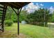 View of backyard with a storage shed with easy access from the basement stairs at 30 W Fork Way, Temple, GA 30179