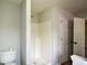 Bathroom featuring a bright white shower stall and white door at 30 W Fork Way, Temple, GA 30179