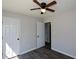 Bedroom featuring gray walls, vinyl flooring, and two doors at 30 W Fork Way, Temple, GA 30179