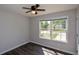 Bedroom featuring a ceiling fan and a large window view at 30 W Fork Way, Temple, GA 30179