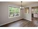 Dining room filled with natural light from a large window, and wood-look floors at 30 W Fork Way, Temple, GA 30179