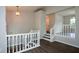 Bright foyer featuring hardwood floors, a pendant light, and views into the adjacent living spaces at 30 W Fork Way, Temple, GA 30179