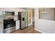 Kitchen featuring stainless steel appliances and a view into the dining area at 30 W Fork Way, Temple, GA 30179