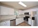 Modern kitchen with stainless steel appliances and white cabinets at 30 W Fork Way, Temple, GA 30179
