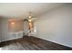 Living room with stairs, ceiling fan, and wood-look floors at 30 W Fork Way, Temple, GA 30179