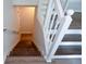 Staircase with white banisters and vinyl flooring at 30 W Fork Way, Temple, GA 30179