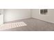 A spacious bedroom with neutral carpet, one window, and base trim at 4028 Trimrose Ct, Atlanta, GA 30349