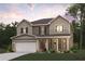 Charming two-story home with covered front porch, attached garage, and beautifully landscaped front yard at 4028 Trimrose Ct, Atlanta, GA 30349