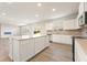 Bright kitchen with island, stainless appliances, and wood flooring at 4028 Trimrose Ct, Atlanta, GA 30349