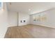 Spacious living room with luxury vinyl plank flooring, electric fireplace, and large windows for natural light at 4028 Trimrose Ct, Atlanta, GA 30349