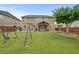 Expansive backyard features a playset and plenty of room to run at 4195 Settlers Grove Rd, Cumming, GA 30028