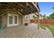 Inviting covered patio with pavers provides a charming backyard retreat at 4195 Settlers Grove Rd, Cumming, GA 30028