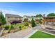 Relaxing backyard featuring lush landscaping, water features, a fire pit, and mature trees at 4195 Settlers Grove Rd, Cumming, GA 30028