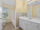 Well-lit bathroom featuring a white vanity, combination tub and shower, and tiled backsplash at 4195 Settlers Grove Rd, Cumming, GA 30028