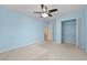Bedroom featuring a ceiling fan, closet, and light blue walls at 4195 Settlers Grove Rd, Cumming, GA 30028