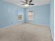 Bedroom featuring light blue walls, carpet, and a ceiling fan at 4195 Settlers Grove Rd, Cumming, GA 30028