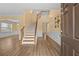 Welcoming foyer featuring hardwood floors, staircase, and elegant decor at 4195 Settlers Grove Rd, Cumming, GA 30028