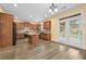 Bright kitchen with stainless steel appliances, wood cabinets, tile backsplash, and patio access at 4195 Settlers Grove Rd, Cumming, GA 30028