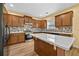 Bright kitchen features wood cabinets, stainless steel appliances, center island, and tile backsplash at 4195 Settlers Grove Rd, Cumming, GA 30028