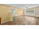 Bright living room featuring wood floors, recessed lighting, ceiling fan, and window bench with built-in shelving at 4195 Settlers Grove Rd, Cumming, GA 30028