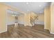 Open-concept living room with hardwood floors and elegant finishes at 4195 Settlers Grove Rd, Cumming, GA 30028