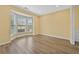 Cozy sitting room with a large bay window and hardwood floors at 4195 Settlers Grove Rd, Cumming, GA 30028