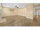 Open-concept living room with hardwood floors and bright, neutral walls at 4195 Settlers Grove Rd, Cumming, GA 30028