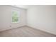 Carpeted bedroom with natural light from the window at 5527 Fairhaven Pl, Fairburn, GA 30213