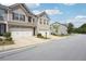 Exterior view of a home showcasing its two-car garage and well-manicured landscaping at 5527 Fairhaven Pl, Fairburn, GA 30213