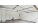 Spacious garage with ample room for parking and storage with an automatic door opener at 5527 Fairhaven Pl, Fairburn, GA 30213