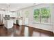 Bright, open kitchen featuring stainless steel appliances and a central island for food prep at 5527 Fairhaven Pl, Fairburn, GA 30213