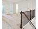 Large upstairs loft area with neutral carpeting and multiple doorways at 5527 Fairhaven Pl, Fairburn, GA 30213