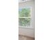 Close up on a window with blinds, letting in natural light and green views at 5527 Fairhaven Pl, Fairburn, GA 30213